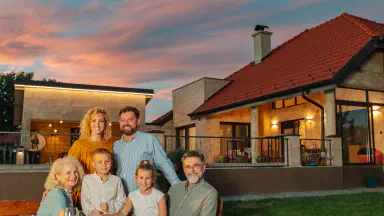 Family enjoying dinner in the backyard.