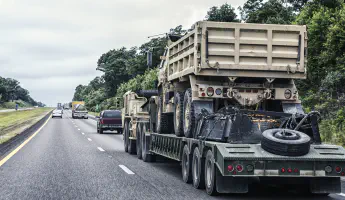 Military truck on a hauler